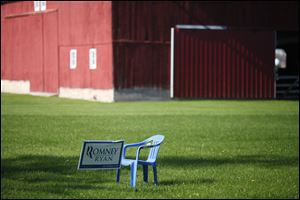 An empty chair, a nod to Clint Eastwood's speech at the Republican National Convention, sits next to a Mitt Romney sign in the front yard of a home near Pemberville. 