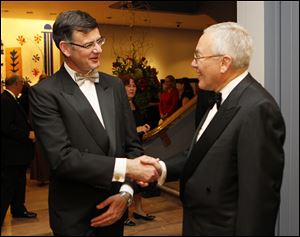 Toledo Museum of Art director Brian Kennedy, left, greets former director Roger Berkowitz.