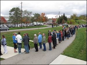 A line of people waiting to see first lady Michelle Obama snakes through the campus of Ohio Wesleyan University in Delaware, Ohio, on Monday.