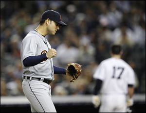 Detroit Tigers' Anibal Sanchez reacts after striking out New York Yankees' Jayson Nix, in background, to end the seventh inning of Game 2 of the American League championship series Sunday in New York.