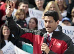 Republican vice presidential candidate, Rep. Paul Ryan holds up what he said was his lucky buckeye that was given to him by Ohio Republican Sen. Rob Portman during a campaign rally today at Lunken Airport in Cincinnati.
