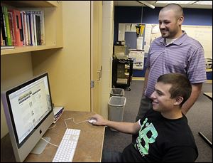 Perrysburg High School students, like Joshua M. Valera, 17, and teacher Ben Fry are involved in the digital launch of the student newspaper, eSomethin.
