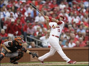 St. Louis Cardinals' Matt Carpenter watches the ball as he hits a two-run home run during the third inning of Game 3.