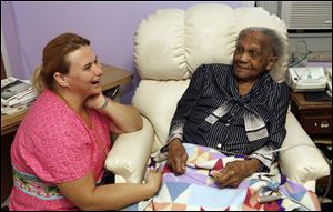 Audrey Lott, who turns 109 today, talks with nurse Annette Krintzline. Lott is the oldest resident Tiffin's St. Francis nursing home has ever had.