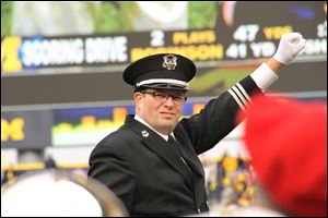 Jon Waters, then interim and now director of the Ohio State marching band is an Elmore native and Woodmore graduate.