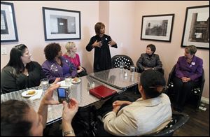 Actress Alfre Woodard speaks Friday during a women's roundtable at Petit Fours Bakery. The event was part of the Obama administration's 