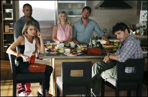 Cast members, clockwise from foreground left, Eliza Coupe, Damon Wayans Jr., Elisha Cuthbert, Zachary Knighton and Adam Pally in a scene from the comedy series 