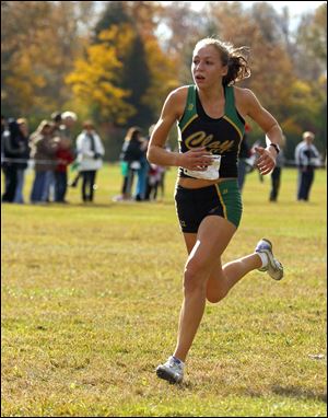 Clay's Erin Gyurke, a junior, got her first district title, winning the race by 14 seconds.