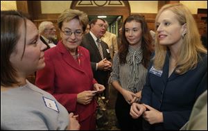 Karen Gallagher, a Ph.D. candidate at the University of Toledo, left, U.S. Rep. Marcy Kaptur, 9th district; Georgia Hudson, an exchange student from the U.K. studying Political Science at Bowling Green State University, and Angela Zimmann, candidate for the US Representative, 5th district of Ohio talk before the forum.