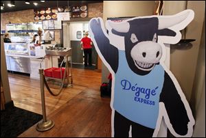 A new sign greets customers in Degage Express- Soups, Sandwiches & Such on October 18, 2012. The restaurant is changing its business model so that it can hopefully generate more money.