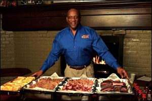 Former Detroit Lion and Heisman Trophy winner running back Billy Sims displays the fare at his Billy Sims Barbecue.