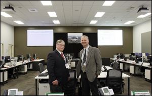 Ray Lieb, left, site vice president of Davis-Besse, and Fred Petersen, right, of Ottawa County EMA director, in the Davis-Besse Nuclear Power Station's new Emergency Operations Facility.