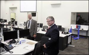 Fred Petersen, left, director of the Ottawa County Emergency Management Agency, and Ray Lieb, site vice president of Davis-Besse, tour the Davis-Besse Nuclear Power Station's new Emergency Operations Facility