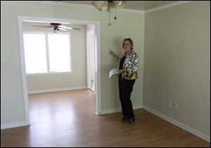 Realtor Kimi George shows a new home for sale in The Village, Okla., last month.