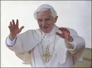 Pope Benedict XVI blesses the faithful in St. Peter's Square at the Vatican for his weekly general audience, Wednesday.