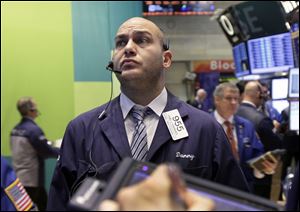 Trader Daniel Chiarmonte works on the floor of the New York Stock Exchange Wednesday.
