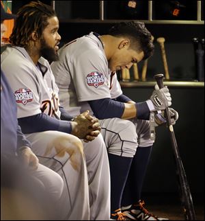 Detroit Tigers' Avisail Garcia and Prince Fielder, left, sit on the bench Wednesday during the ninth inning of Game 1 of baseball's World Series against the San Francisco Giants.