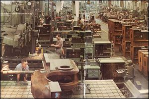 Workers get down to business at National Machinery Co. in 1974. The plant, a few blocks from downtown Tiffin, began operations in that Seneca County community during the 1880s.