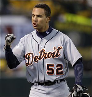 Detroit Tigers' Quintin Berry, a former player for the Mud Hens, pumps his fist after scoring on a single by Delmon Young during earlier this month against Oakland in the ALDS.