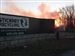 The-sun-rises-behind-Stickney-Recycling-Plant.jpg The sun rises behind Stickney Recycling Plant, as a fire smolders in the distance.
