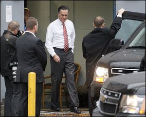 Republican presidential candidate, Gov. Mitt Romney, exits the Hilton hotel in Toledo through a service entrance, Friday morning.