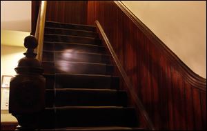 An orb of light on the back stairway that might be lens flare.