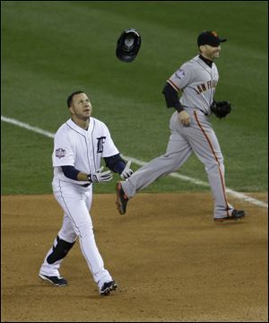 Detroit's Jhonny Peralta tosses his helmet after he popped out in the sixth inning of Game 3. The Tigers have been shut out in back-to-back games, the first time that has happened in the World Series since the Orioles did it to the Dodgers in 1966.