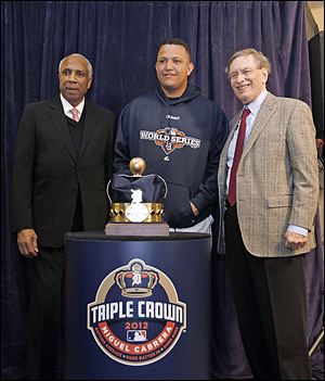 Frank Robinson, left, and MLB commissioner Bud Selig, right, presents Miguel Cabrera with his Triple Crown award before Game 3. Cabrera also won the Al Hank Aaron Award this season.