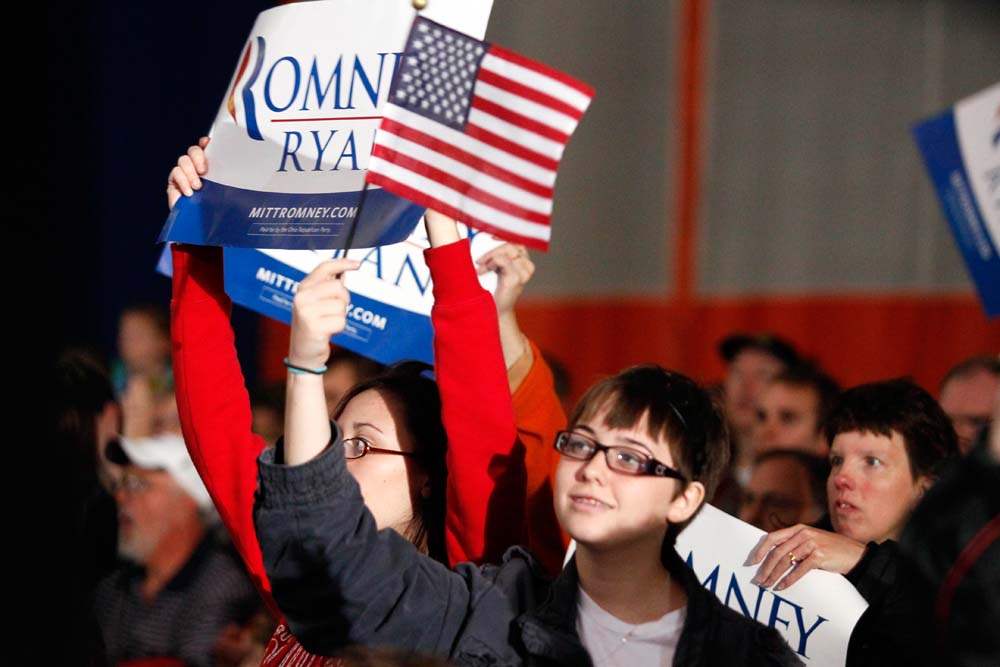 Supporters-hold-flags-for-Republican-presidential