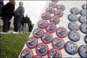 Campaign buttons for sale outside of the University of Findlay Koehler Athletic Complex while the crowd lines up to see Mitt Romney and Paul Ryan.