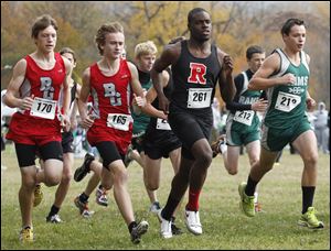 Rogers’ Michael Lipkins, No. 261, strives to lead the pack, knowing that winning enhances his chances of earning a college scholarship.