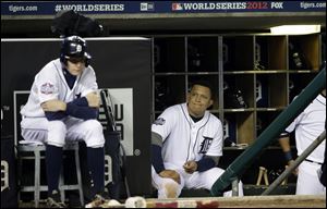 Miguel Cabrera watches from the dugout during the ninth inning of Game 3 of baseball's World Series against the San Francisco Giants Saturday in Detroit.