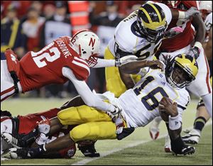 Michigan quarterback Denard Robinson reportedly injured his elbow during the game.