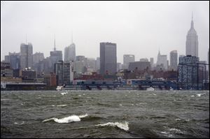 The New York City skyline and Hudson River are seen from Hoboken, N.J., as Hurricane Sandy approaches on Monday.