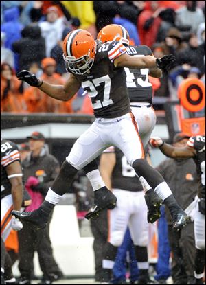 Cleveland Browns safety Eric Hagg (27) and T.J. Ward celebrate after stopping the San Diego Chargers on fourth down in the final seconds of a 7-6 win by the Browns on Sunday in Cleveland.