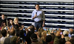 Republican presidential candidate, former Massachusetts Gov. Mitt Romney speaks at a storm relief event at James S. Trent Arena in Kettering, Ohio. Gov. Romney made brief remarks and then collected food and donations for storm relief. 