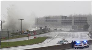A low-lying section of Interstate 90 east of downtown Cleveland is shut down because of waves from Lake Erie washing over it.