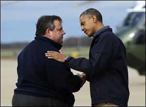 President Obama is greeted by New Jersey Gov. Chris Christie upon his arrival at Atlantic City International Airport, Wednesday.