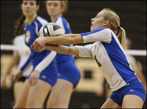 Maurissa Leonard  returns a serve in the Division I district championship. The junior setter/rightside hitter is tops on the Arrows with 234 digs.