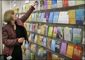 A woman looks over a selection of greeting cards at Hallmark Cards Inc. headquarters in Kansas City, Mo.