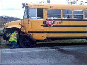 Bus No. 43 sits along the side of the road after a crash early today.