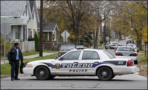 Toledo police block Blum Street at Hawley Street in Toledo, following a report of two people shot.