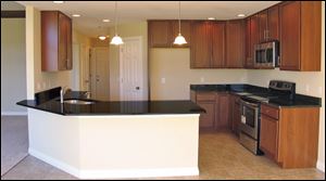 The gourmet kitchen features lots of granite-topped counter space.