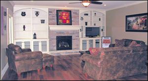 The great room incorporates natural elements like stone and Brazilian Teak flooring for a relaxed feel.