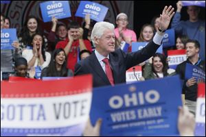 Former President Bill Clinton  stumps for the Obama-Biden ticket at an appearance at Owens Community College.