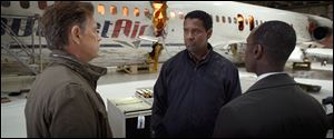 from left, Bruce Greenwood as Charlie Anderson, Denzel Washington as Whip Whitaker and Don Cheadle as Hugh Lang in a scene from 