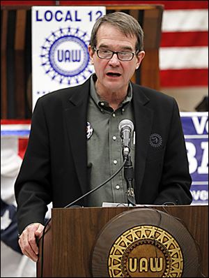 Bob King, president of the United Auto Workers union, speaks at the UAW Local 12 hall in Toledo. He says the public deserves to know how much Mitt Romney bet against American workers with his investments.