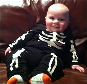 Max Kleiboemer, 5 months, happily passed out Halloween candy this week.