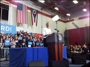 President Barack Obama addresses the crowd during a campaign stop at a high school in Lima, Ohio.