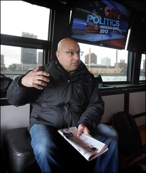 CNN's Ali Velshi on the CNN Election Express bus 2012.  The CNN Election Express bus is traveling to 4 swing states to interview voters, including a stop in Toledo, where it was parked along the Maumee River in International Park.